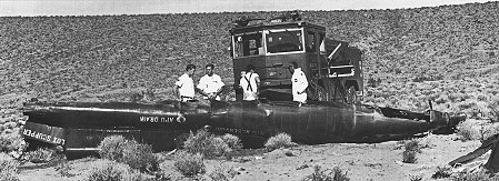 A fire truck is parked near the remains of the X-15 no. 3 forward fuselage on 15 November 1967.